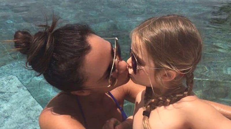Victoria Beckham and her daughter kiss on the lips